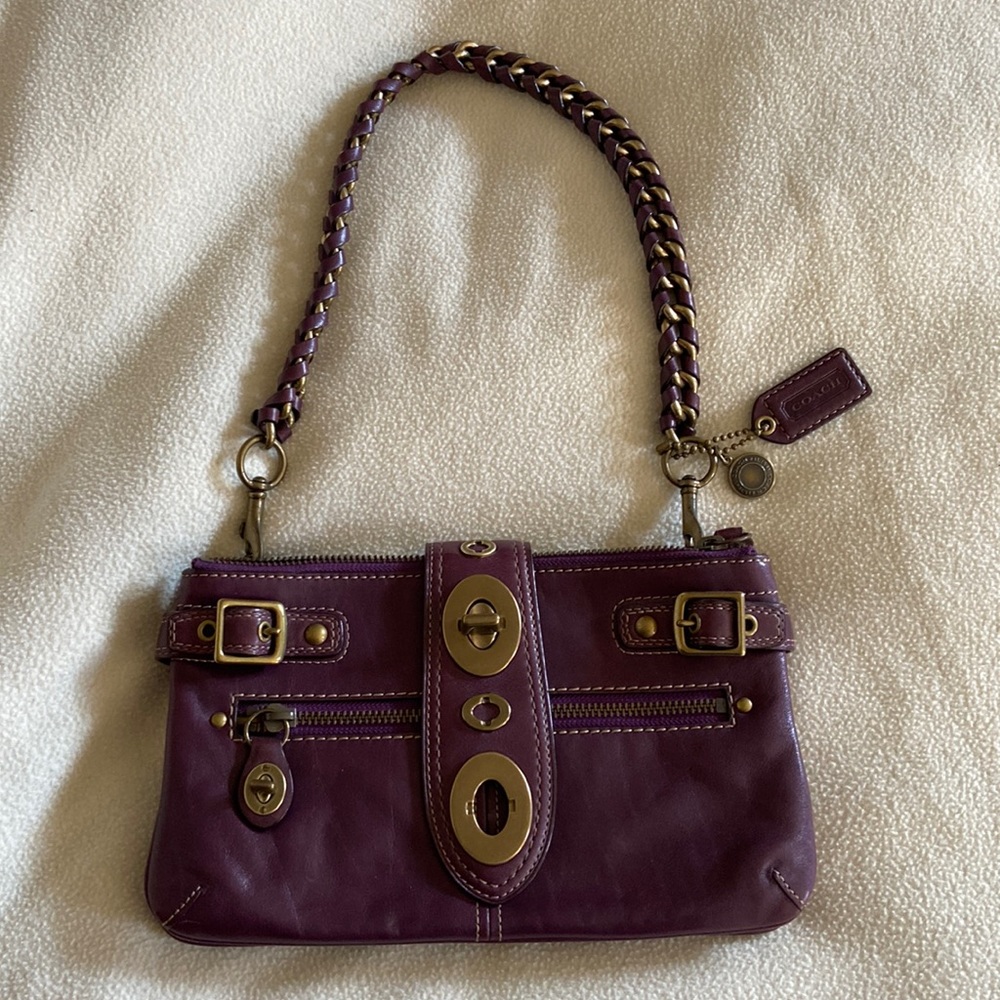 Dark purple Coach bag with gold hardware